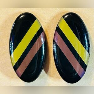 Vintage earrings featuring a glossy, oval design with black, yellow, and mauve